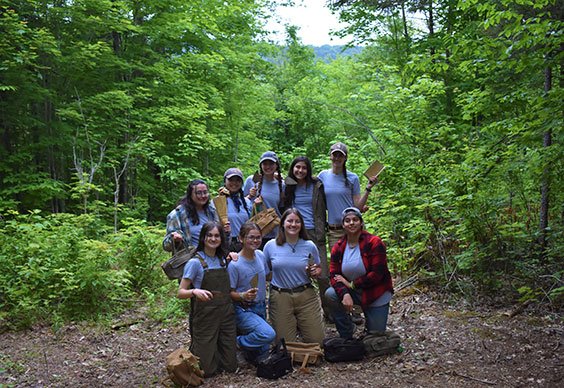 Group of students on an archaeological dig in northern Maine