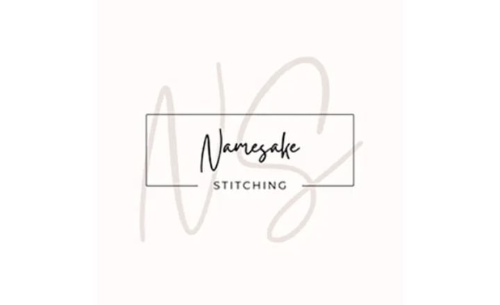 pale pink square with large NS and namesake stitching as an overlay