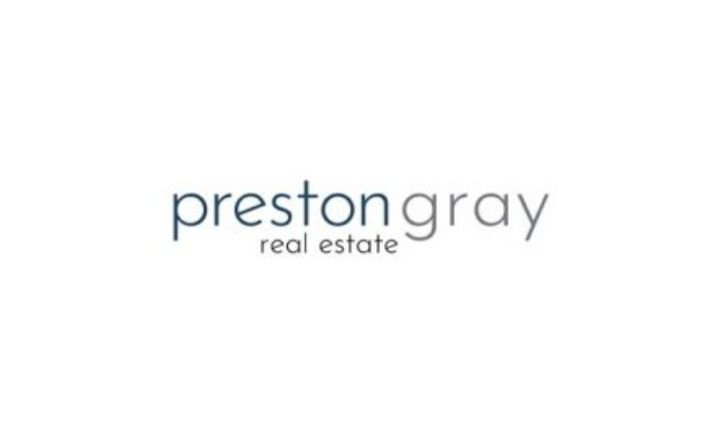 Preston gray real estate logo in grey font