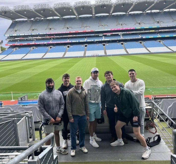 Students hold a replica of the MacCarthy Cup at Croke Park.