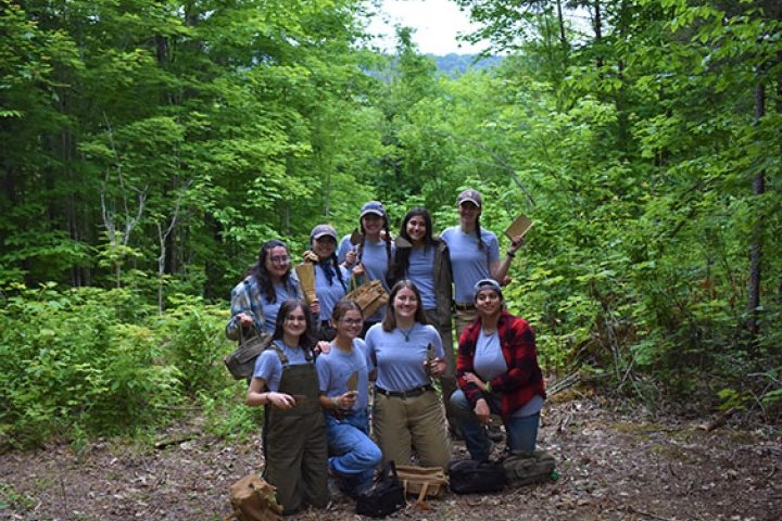 Group of students on an archaeological dig in northern Maine
