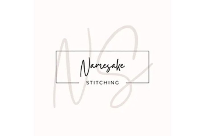 pale pink square with large NS and namesake stitching as an overlay