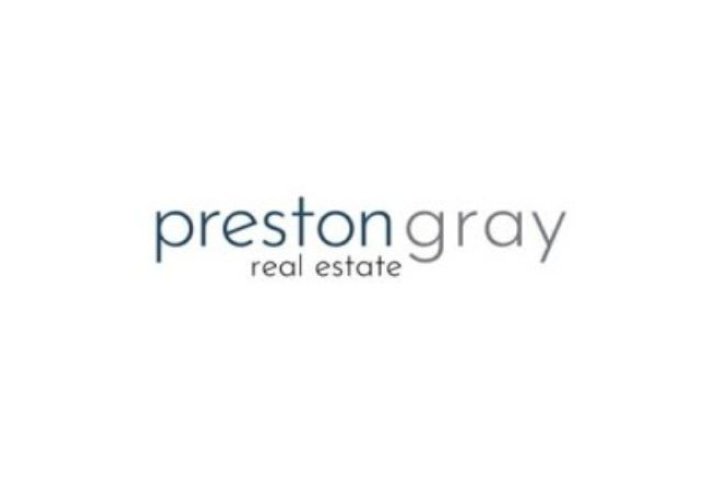 Preston gray real estate logo in grey font