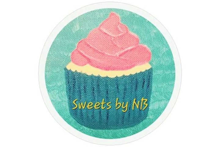 Teal and pink cupcake with Sweets by NB written on the wrapper in an aqua circle