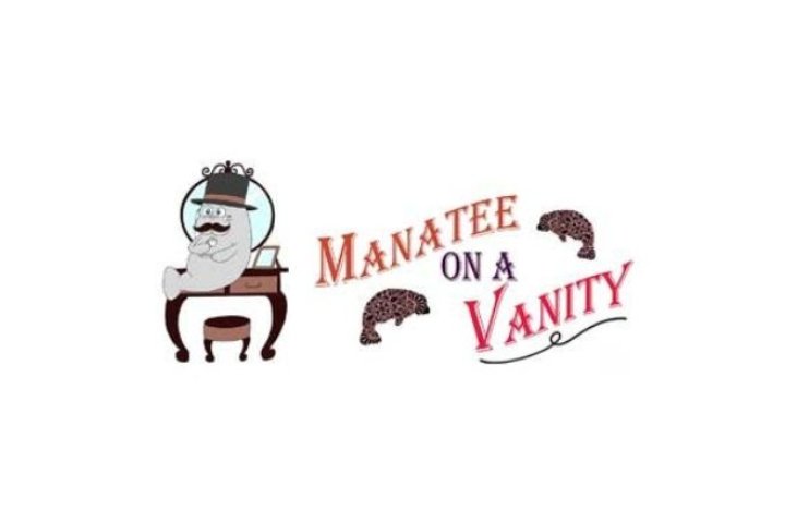 A manatee wearing a crown sitting on a vanity, with the company name to the right of the image