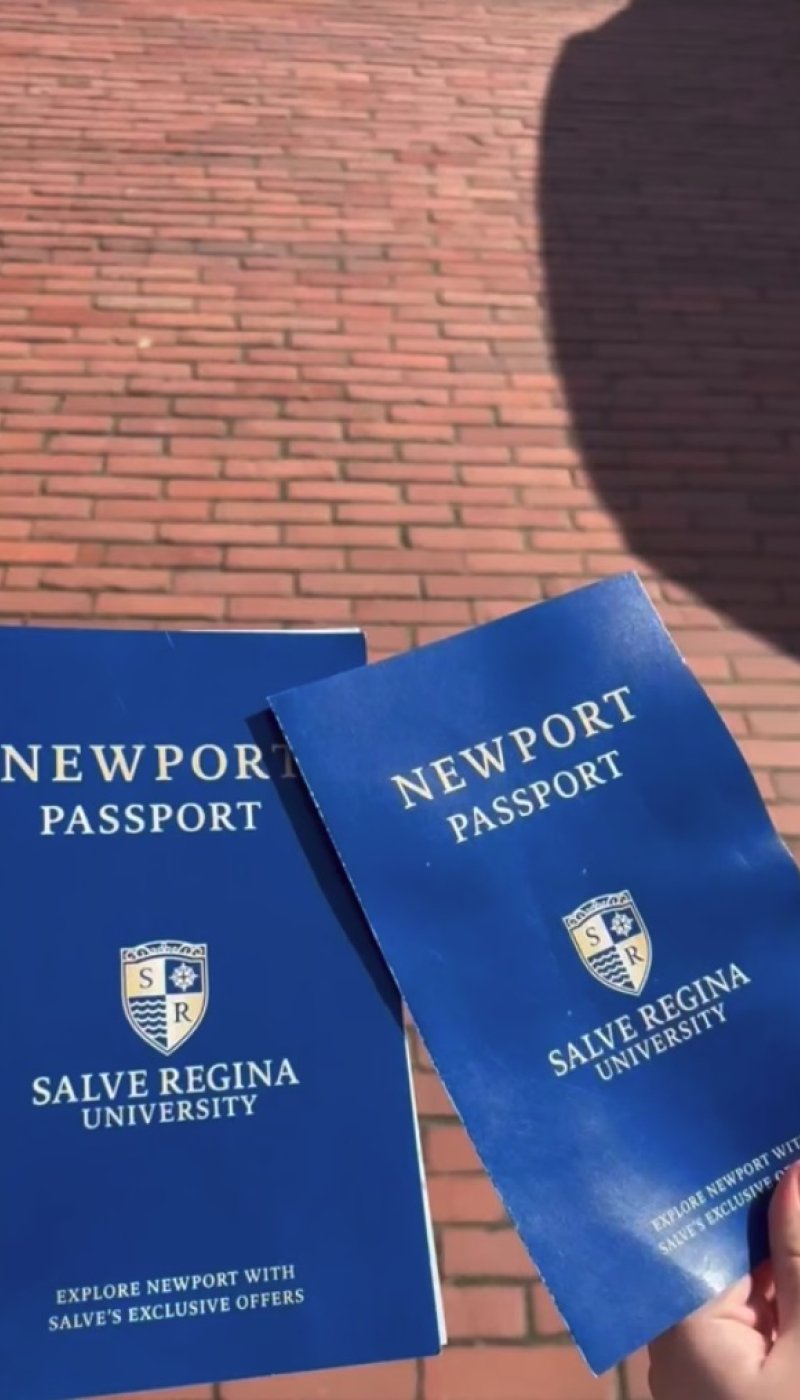 Two blue booklets with the words "Newport Passport" and "Salve Regina University" on the front.