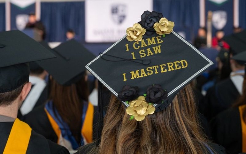 Mortarboard decorated with the phrase "I came. I saw. I Mastered."