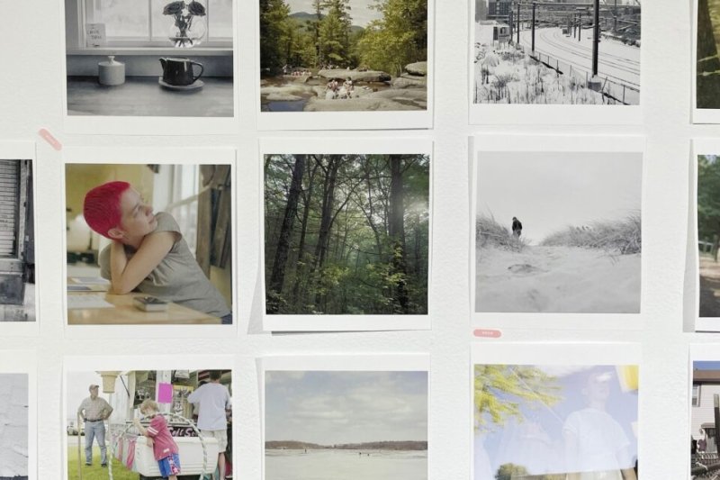 A collection of photographs hanging on a wall