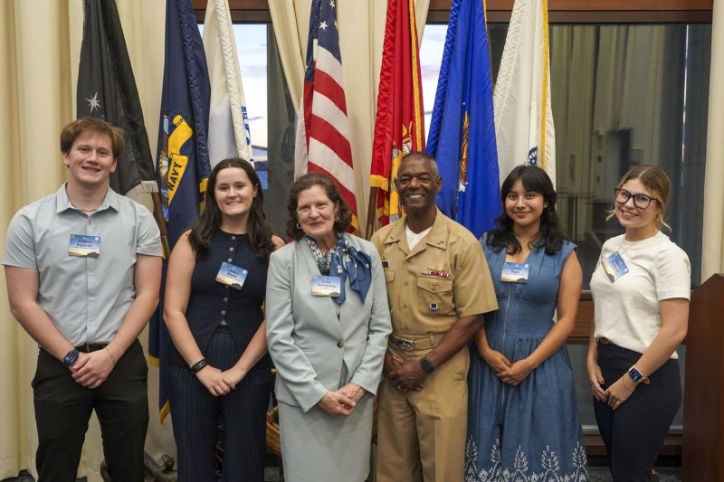 Salve Regina students with President Armstrong, Naval War College President Adm. Walker.