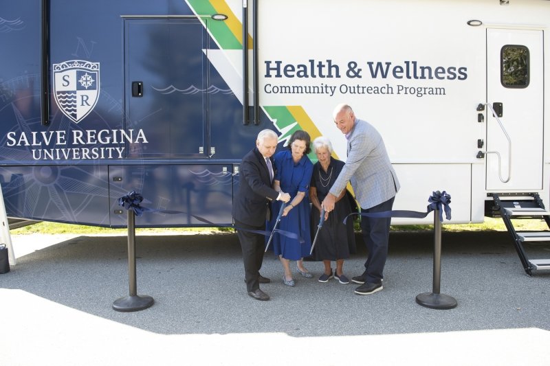 U.S. Senator Jack Reed, Salve Regina University President Dr. Kelli J. Armstrong, Salve Regina University Chancellor Dr. M. Therese Antone and Newport Mayor Charlie Holder cut the ribbon to launch Salve's new health and wellness mobile outreach program.