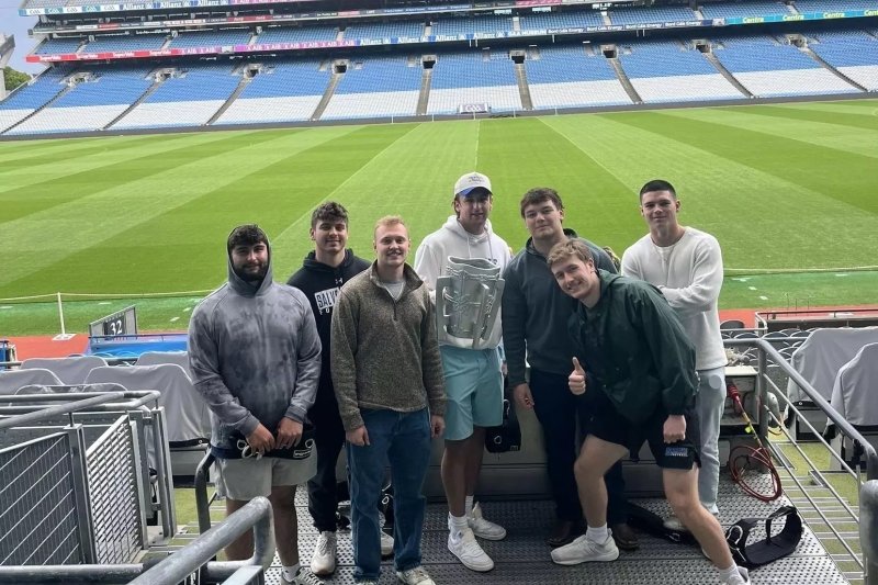 Students hold a replica of the MacCarthy Cup at Croke Park.