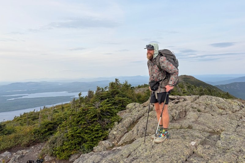 Crocker at the top of a mountain, hiking the Appalachian Trail.