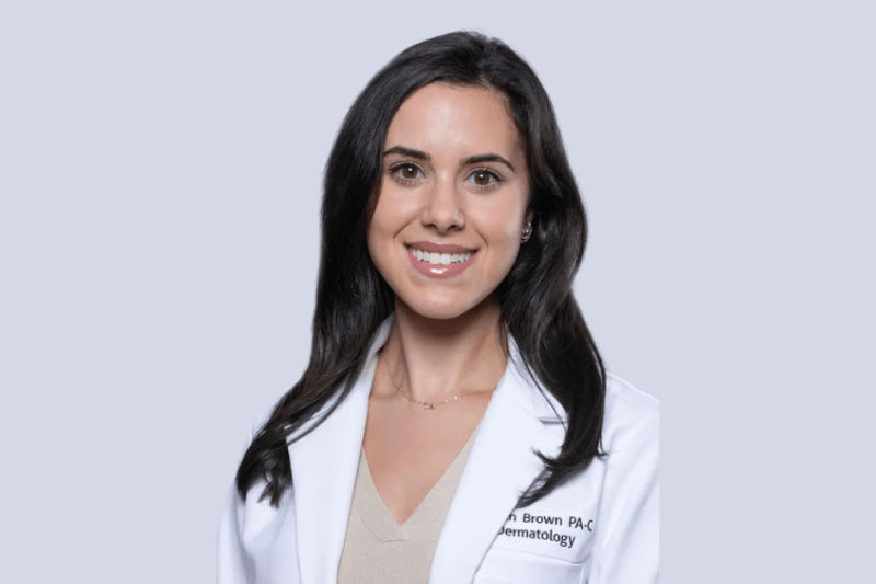 Professional headshot of Brown in her white lab coat.