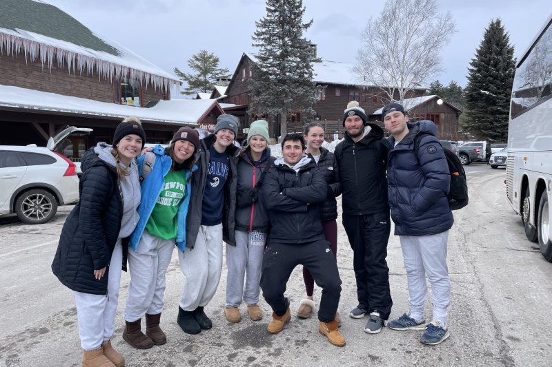 Group photo of Gracie and the Ski and Snowboarding Club at a ski resort.