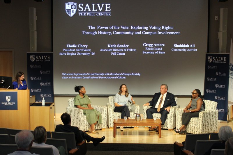 Panelists on stage at Pell Center event