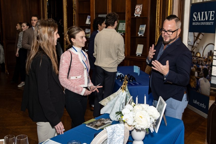 Students talking to industry professionals at the Career and Internship Expo.