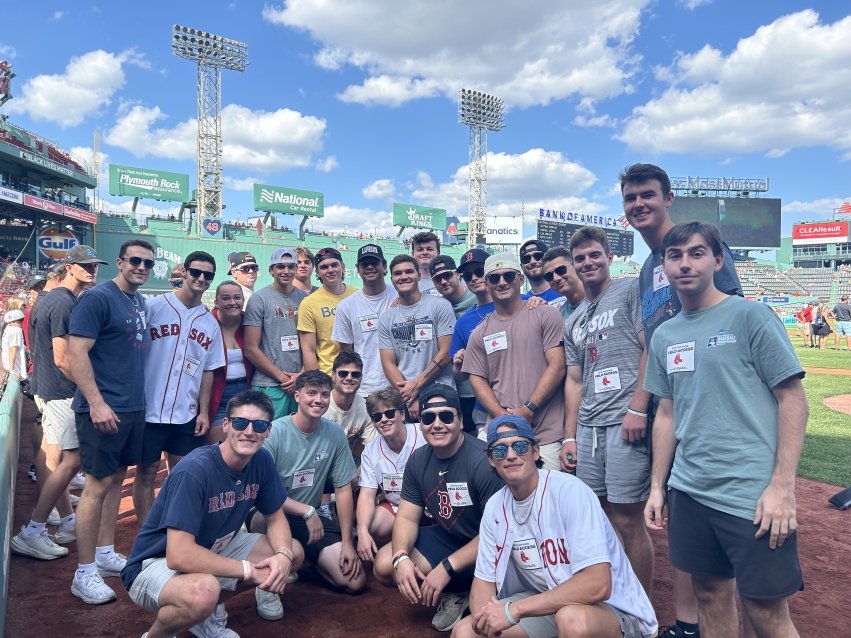 The Salve baseball team on the field at Fenway in 2024. The team was celebrated before a Red Sox game for advancing to the Division III World Series for the first time in program history.