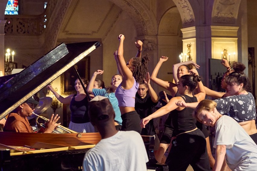 people dancing jazz in a circle near a piano in Ochre Court