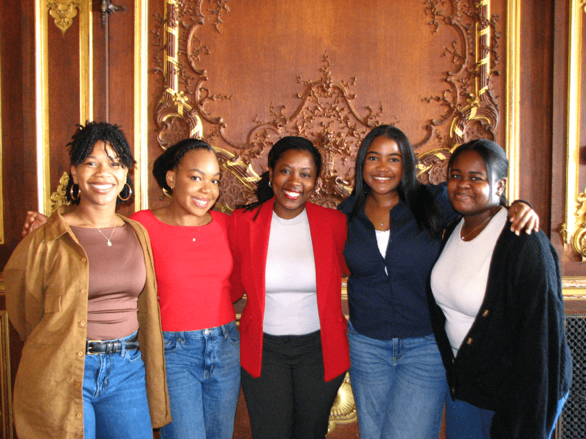 Ashley Blake '26, Marsara Dunbar '27, event speaker Rose Albert '13, Zora Felix '26, and Nyla White '26 at “Coffee or Tea: Let’s Talk Inclusion” during Multicultural Education Week.
