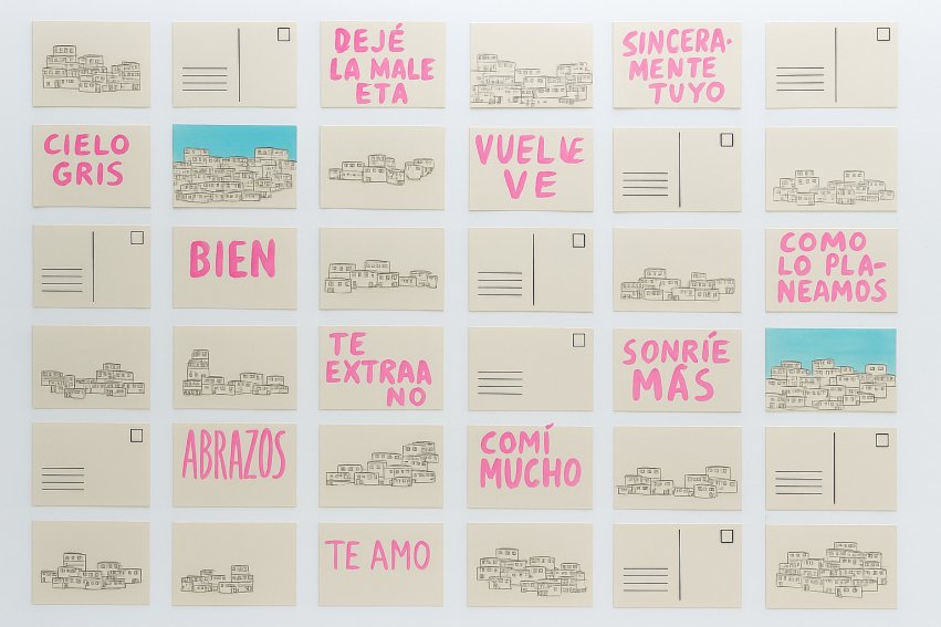 A piece of artwork featuring many squares with phrases written in Spanish
