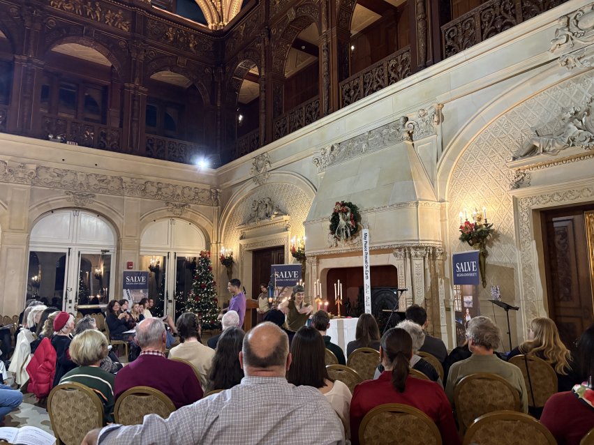 students dancing in front of a crowd in Ochre Court's Great Hall.