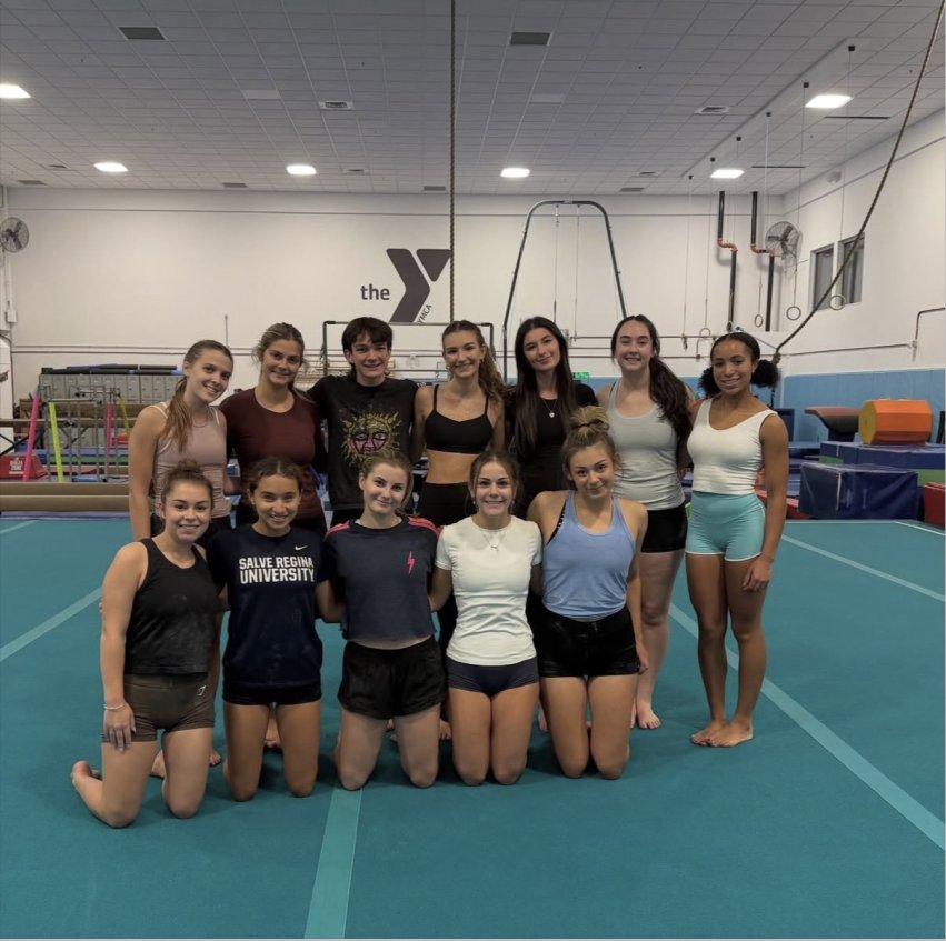 group photo of the Salve gymnastics team on the mat.