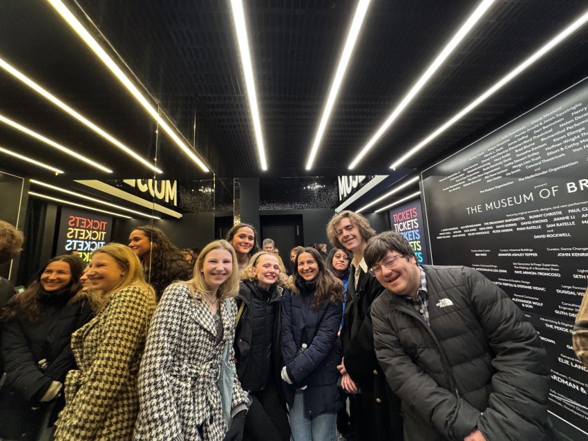 Students smiling for a photo at the Museum of Broadway.