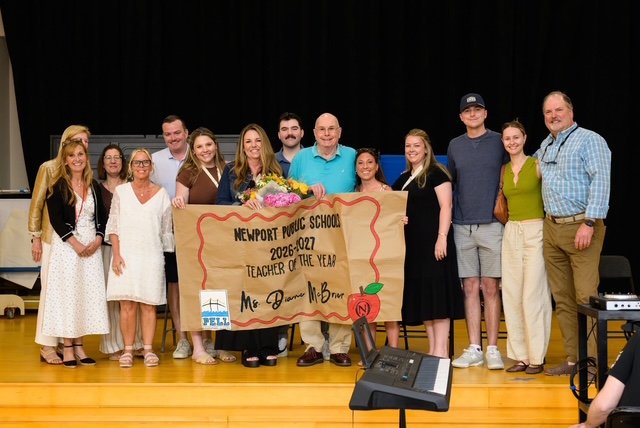Diane McBrier stands with family and loved ones after being named Newport Public Schools Teacher of the Year.
