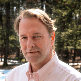 Professional headshot of Ruhlman in nature.