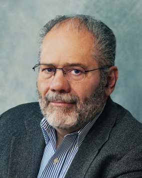 Professional headshot of Suarez