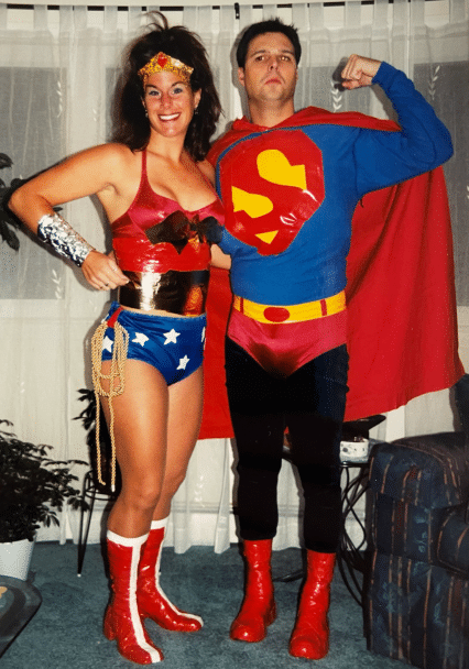 Two people dressed as Wonder Woman and Superman.