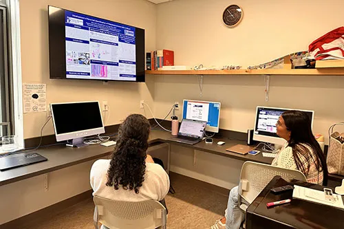 Two students review their presentation