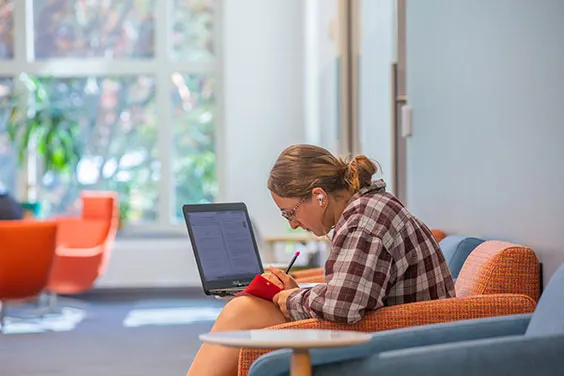 A student in Salve Regina's McKillop Library
