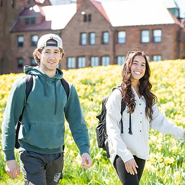 Students along the Cliff Walk behind McAuley Hall